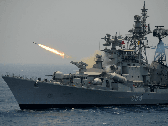 A rocket is fired from the Indian Navy destroyer ship INS Ranvir during an exercise drill in the Bay Of Bengal off the coast of Chennai on April 18, 2017. / AFP PHOTO / ARUN SANKAR (Photo credit should read ARUN SANKAR/AFP/Getty Images)