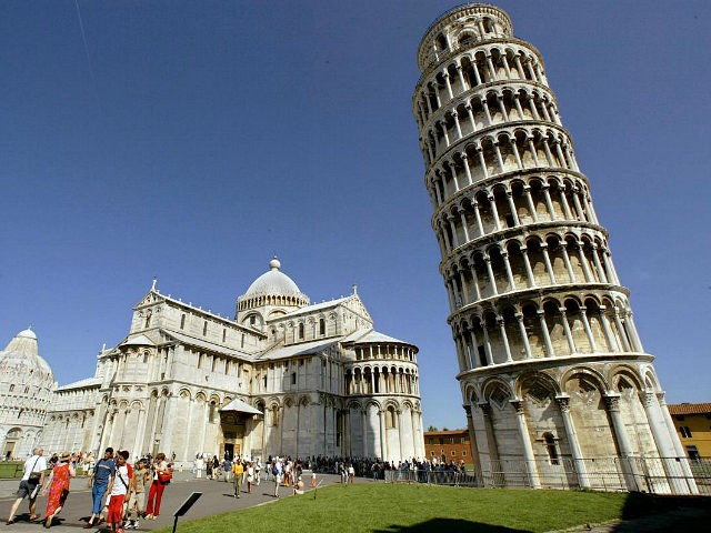 PISA, ITALY - AUGUST 24: Tourists visit the Leaning Tower of Pisa and the Cathedral in the