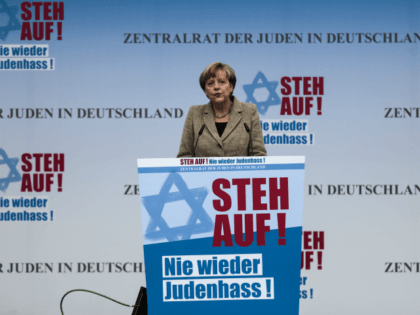 German Chancellor Angela Merkel delivers her speech at a rally against anti-Semitism near