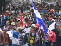 migrant caravan Honduran migrants take part in a caravan towards the United States in Chiquimula, Guatemala on October 17, 2018. - A migrant caravan set out on October 13 from the impoverished, violence-plagued country and was headed north on the long journey through Guatemala and Mexico to the US border. President Donald …