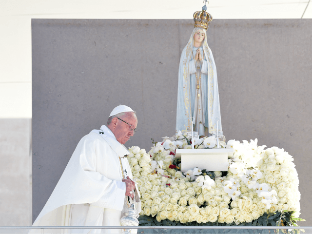 Pope Francis celebrates a centenary mass marking the apparition of the Virgin Mary at Fatima's Sanctuary, central Portugal, on May 13, 2017. Two of the three child shepherds who reported apparitions of the Virgin Mary in Fatima, Portugal, one century ago, will be declared saints today by Pope Francis. The …