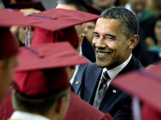 JOPLIN, MO - MAY 21: U.S. President Barack Obama greets Joplin High School graduates just