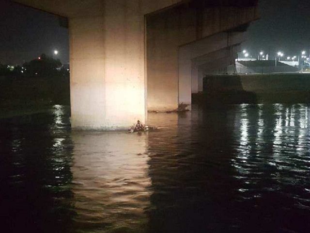 Border Patrol agents rescue Honduran migrant from a bridge pedestal in the Rio Grande Rive