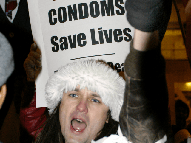 A protester yells at a rally outside the Center for Disease Control-sponsored 2004 National STD Prevention Conference March 10, 2004 in Philadelphia, Pennsylvania. About 250 demonstrators attended the rally to criticize President Bush?s plan to expand abstinence-only education in the fight against sexually transmitted diseases. (Photo by Jeff Fusco/Getty Images)