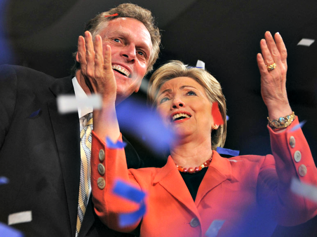 Then-Sen. Hillary Rodham Clinton and then-campaign chairman Terry McAuliffe celebrate at Clinton’s primary election night celebration on May 13, 2008 in Charleston, W.Va. (Robyn Beck/AFP/Getty Images)