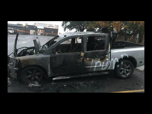 Johnny MacKay, a truck owner whose vehicle was set ablaze and vandalized with spray paint