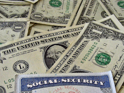 Social Security Card A social security card on a bed of money