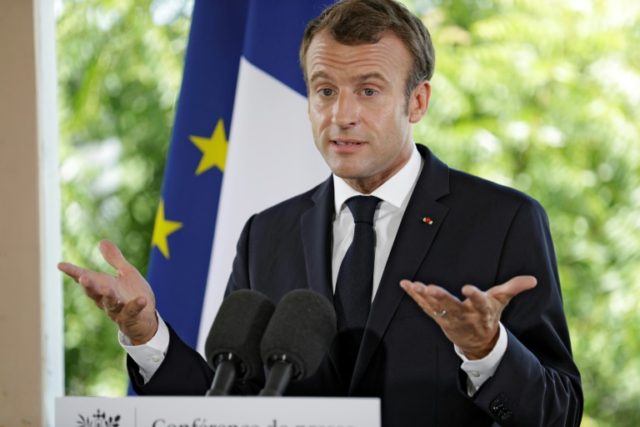 Macron flips back over 'middle finger' photo