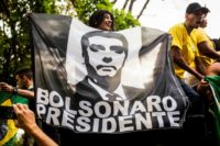 Supporters of Brazilian right-wing presidential candidate Jair Bolsonaro welcome the politician as he arrives in Rio de Janeiro after he was discharged from a Sao Paulo hospital where he was treated for a knife wound