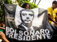 Supporters of Brazilian right-wing presidential candidate Jair Bolsonaro welcome the politician as he arrives in Rio de Janeiro after he was discharged from a Sao Paulo hospital where he was treated for a knife wound Poll surge for right-winger spurs Brazil markets