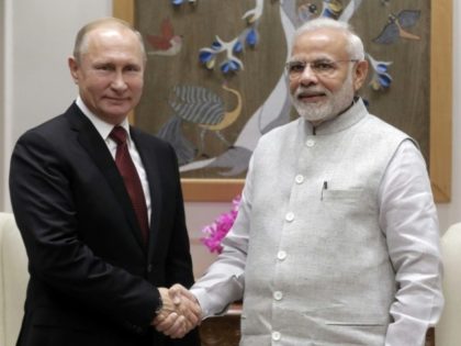 Hugs as Putin clinches India defence deal
