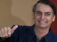 Brazil's right-wing presidential candidate Jair Bolsonaro gives a thumb up after voting in Rio de Janeiro Brazil's right-wing presidential candidate Jair Bolsonaro gives a thumb up after voting in Rio de Janeiro
