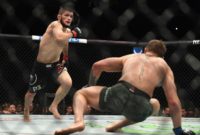 Russia's Khabib Nurmagomedov (L) chases down Conor McGregor in their UFC lightweight championship bout in Las Vegas