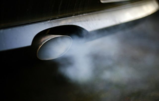 Divided EU ministers agree auto emission curbs