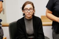 US student Lara Alqasem sits for a hearing at the Tel Aviv district Court on October 11, 2018 US student Lara Alqasem sits for a hearing at the Tel Aviv district Court on October 11, 2018