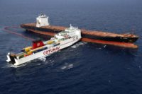 Aerial view taken from an helicopter on October 10 shows two cargo ships - the Tunisian freighter Ulysse (L) and the Cyprus-based vessel anchored CLS Virginia - after they collided about 30 kilometres (20 miles) off the northern tip of the French Mediterranean island of Corsica. Officials now say the …