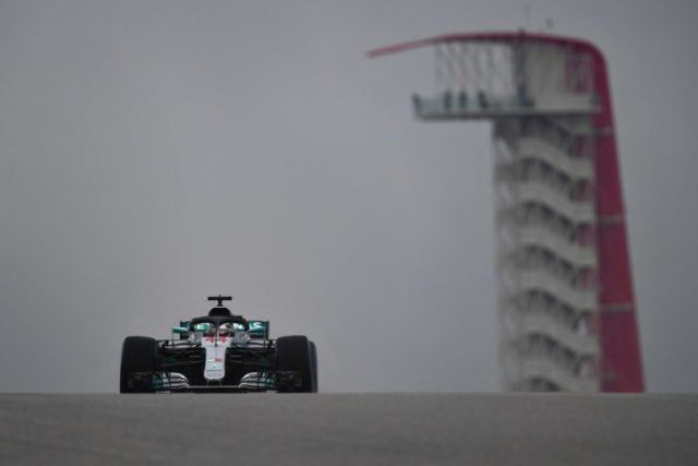 Title-chasing Hamilton shines in Texas rain