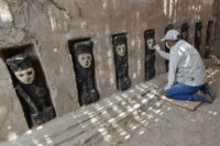 An expert works on excavation of the ceremonial corridor where 20 pre-Columbian wooden statues were found