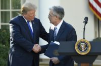 US President Donald Trump (L) said it was "too early to say" if he regretted nominating Jerome Powell (R)