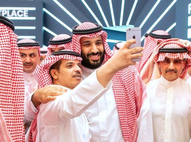 Saudi Crown Prince Mohammed bin Salman, seen here posing for a selfie during a brief appearance at the opening of a flagship investment forum in Riyadh, is scheduled on day two to give his first speech since the murder of critic Jamal Khashoggi