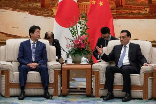 Japan's Abe meets Chinese premier as relations thaw
