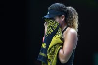 Japan's Naomi Osaka was forced to retire from the WTA Finals with a left hamstring injury