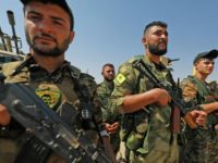 Members of the People's Protection Units (YPG), part of the of the Syrian Democratic Forces (SDF), gather in eastern Syria on September 11, 2018 Members of the People's Protection Units (YPG), part of the of the Syrian Democratic Forces (SDF), gather in eastern Syria on September 11, 2018
