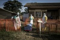 Medical workers disinfect the coffin of a deceased unconfirmed Ebola patient inside an Ebola Treatment Centre run by The Alliance for International Medical Action (ALIMA) in Beni; DR Congo's health ministry has said a new outbreak has claimed 170 lives