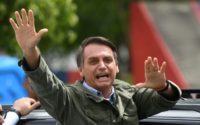 Jair Bolsonaro, far-right lawmaker and presidential candidate for the Social Liberal Party (PSL), gives thumbs up to supporters, during the second round of the presidential elections, in Rio de Janeiro, Brazil