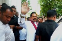 Sri Lanka's newly appointed Prime Minister Mahinda Rajapaksa has given four legislators from his political rival's party ministerial portfolios