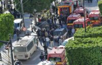 A picture shows police and firemen gathering at the site of Monday's suicide attack in the centre of the Tunisian capital Tunis Woman suicide bomber wounds 9 in Tunis: ministry