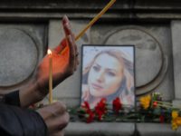 Bulgaria Journalist Killed A woman holds a candle next to a portrait of slain television reporter Viktoria Marinova during a vigil at the Liberty Monument in Ruse, Bulgaria, Monday, Oct. 8, 2018. Bulgarian police are investigating the rape, beating and slaying of a female television reporter whose body was dumped near the Danube River after she reported on the possible misuse of European Union funds in Bulgaria (AP Photo/Vadim Ghirda) The Associated Press