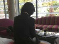 Grace Meng, the wife of missing Interpol President Meng Hongwei, who does not want her face shown, consults her mobile phone in the lobby of a hotel in Lyon, central France, where the police agency is based, on Sunday Oct. 7, 2018. Interpol said Saturday it has made a formal request to China for information about the agency's missing president, a senior Chinese security official who seemingly vanished while on a trip home. (AP Photo/John Leicester) Grace Meng, the wife of missing Interpol President Meng Hongwei, who does not want her face shown, consults her mobile phone in the lobby of a hotel in Lyon, central France, where the police agency is based, on Sunday Oct. 7, 2018. Interpol said Saturday it has made a formal …