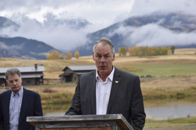 Coal Exports Military Bases Ryan Zinke In this Oct. 8, 2018 photo, U.S. Interior Secretary Ryan Zinke announces a ban on mining claims north of Yellowstone National Park as K.C. Walsh, left, president of Simms Fishing Products, listens near Emigrant, Mont. The Trump administration is considering using West Coast military bases or other federal properties as transit points for shipments of U.S. coal and natural gas to Asia as officials seek to bolster the domestic energy industry and circumvent environmental opposition to fossil fuel exports, according to Zinke and two Republican lawmakers. (AP Photo/Matthew Brown) The Associated Press