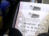 Lottery Jackpot Mega Millions lottery tickets are printed out of a lottery machine at a convenience store Wednesday, Oct. 17, 2018, in Chicago. The estimated jackpot for Friday's drawing would be the second largest lottery prize in U.S. history with a jackpot estimated to exceed $900 million. (AP Photo/Nam Y. Huh) The Associated Press