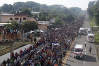 A ragged, growing army of migrants resumes march toward US