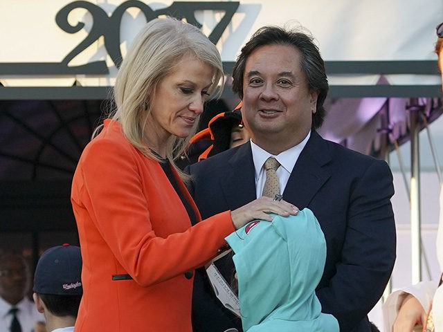 Counselor to the President Kellyanne Conway, center, and her husband George Conway, right, greet guests on the South Lawn of the White House in Washington during a Halloween event welcoming children from the Washington area and children of military families to trick-or-treat, Monday, Oct. 30, 2017. (AP Photo/Pablo Martinez Monsivais)