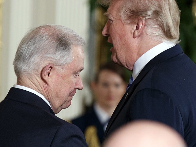 Attorney General Jeff Sessions walks past President Donald Trump after introducing him to