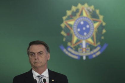 Brazil's President-elect Jair Bolsonaro attends a joint statement with Brazil's president, after a meeting at the Presidential Palace, in Brasilia, Brazil, Wednesday, Nov. 7, 2018. (AP Photo/Eraldo Peres)
