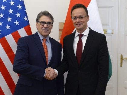 Hungarian Minister of Foreign Affairs and Trade Peter Szijjarto, right, welcomes US Secretary of Energy Rick Perry at the Ministry of Foreign Affairs and Trade in Budapest, Hungary, Tuesday, November 13, 2018. (Lajos Soos/MTI via AP)