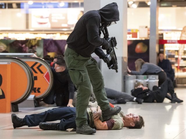 In this Nov. 20, 2018 photo a man acting as a terrorist shoots a mock victim during an ant