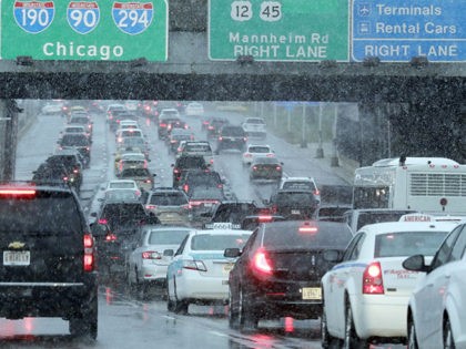 Heavy traffic is seen on Interstate 190 near O'Hare International Airport in Chicago, Sunday, Nov. 25, 2018. A winter storm is expected to dump snow across the Midwest, on one of the busiest travel days of the year. (AP Photo/Nam Y. Huh)