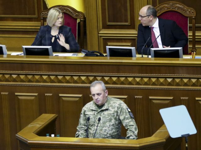 Chairman of the Ukrainian General Staff Viktor Muzhenko, bottom, speaks during a parliamen