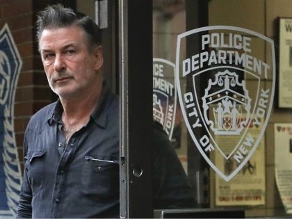 Actor Alec Baldwin walks out of the New York Police Department's 10th Precinct, Friday, Nov. 2, 2018, in New York. Baldwin was arrested Friday after allegedly punching a man in the face during a dispute over a parking spot outside his New York City home, authorities said.(AP Photo/Julie Jacobson)