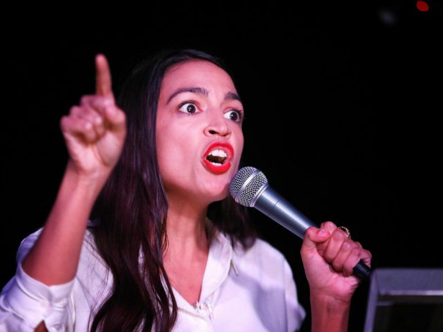 Alexandria Ocasio-Cortez addresses the crowd gathered at La Boom night club in Queens on November 6, 2018 in New York City. With her win against Republican Anthony Pappas, Ocasio-Cortez became the youngest woman elected to Congress. (Photo by Rick Loomis/Getty Images)