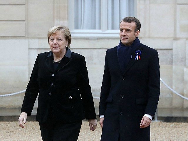 German Chancellor Angela Merkel (L) and French President Emmanuel Macron arrive to attend a lunch at the Elysee Palace in Paris on November 11, 2018 during commemorations marking the 100th anniversary of the 11 November 1918 armistice, ending World War I. (Photo by Jacques Demarthon / AFP) (Photo credit should …