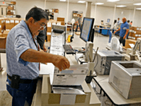 Arizona Vote Count House 2016 Arizona 5th District An Arizona elections official at the Maricopa County Recorder's Office inserts ballots into a machine to recount the votes in the 5th Congressional District race Tuesday, Sept. 13, 2016, in Phoenix. Arizona officials on Tuesday began counting thousands of ballots in the razor-thin Republican primary …