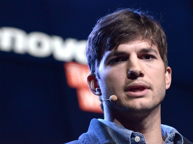 US actor Ashton Kutcher presents Lenovo's first multi mode tablet Yoga Tablet during Lenovo, a Chinese computer maker, press conference at Youtube Space on October 29, 2013 in Los Angeles, California.AFP PHOTO/JOE KLAMAR (Photo credit should read JOE KLAMAR/AFP/Getty Images)