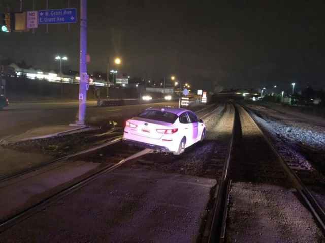Driver stuck on train tracks after following GPS