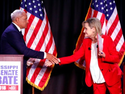 Appointed U.S. Sen. Cindy Hyde-Smith, R-Miss., right, and Democrat Mike Espy shake hands following their televised Mississippi U.S. Senate debate in Jackson, Miss., Tuesday, Nov. 20, 2018. (AP Photo/Rogelio V. Solis, Pool)